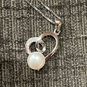 Helzberg Diamonds pearl and diamond heart necklace.